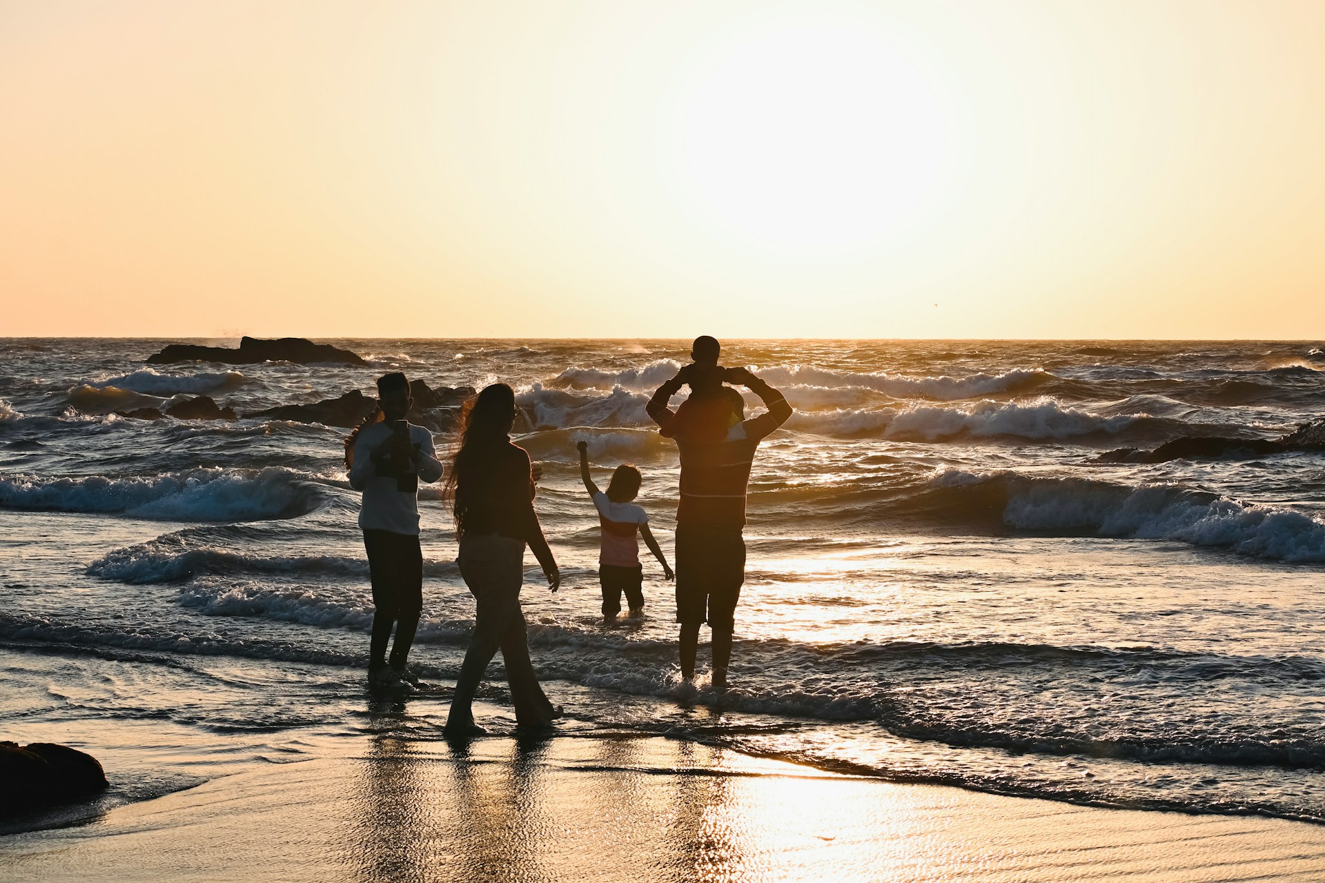 A family walking together on a beach